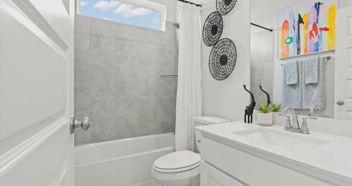Representative furnished interior of a home built from the Davis by Chesmar Homes in Stream Waters, Buda (Image 28).