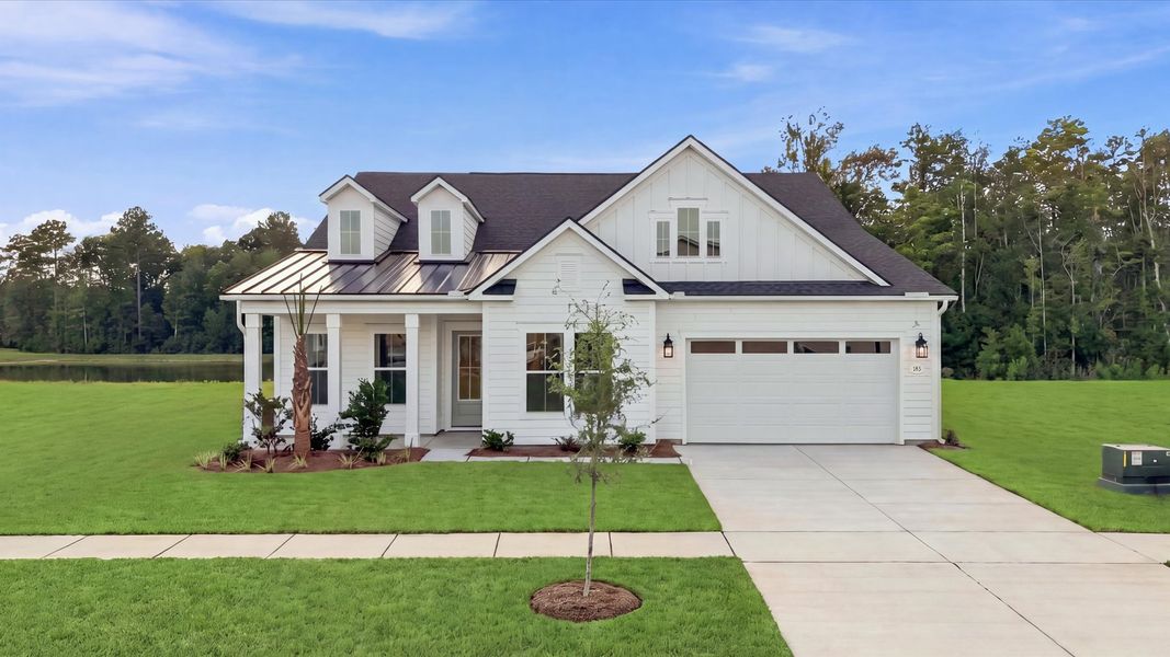 Representative exterior photo of a completed home built from the Inspire by DRB Elevate. in Summerwind Crossing at Lakes of Cane Bay, Summerville, SC (Image 21). Representative exterior photo of a completed home built from the Inspire by DRB Elevate. in Summerwind Crossing at Lakes of Cane Bay, Summerville, SC (Image 21).