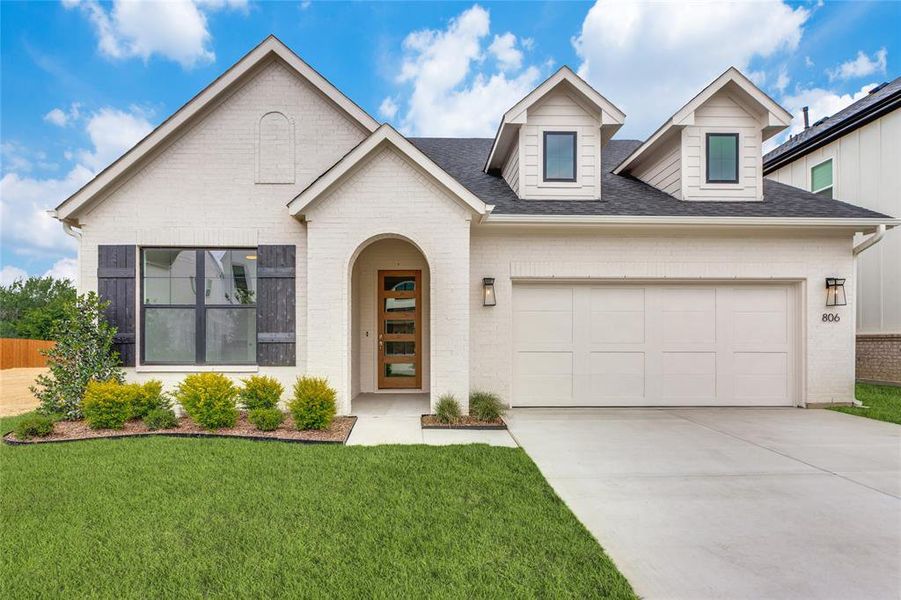 Front exterior of a new home in The Lakes at Parks of Aledo, Aledo, TX, highlighting curb appeal (Image 2). Front exterior of a new home in The Lakes at Parks of Aledo, Aledo, TX, highlighting curb appeal (Image 2).