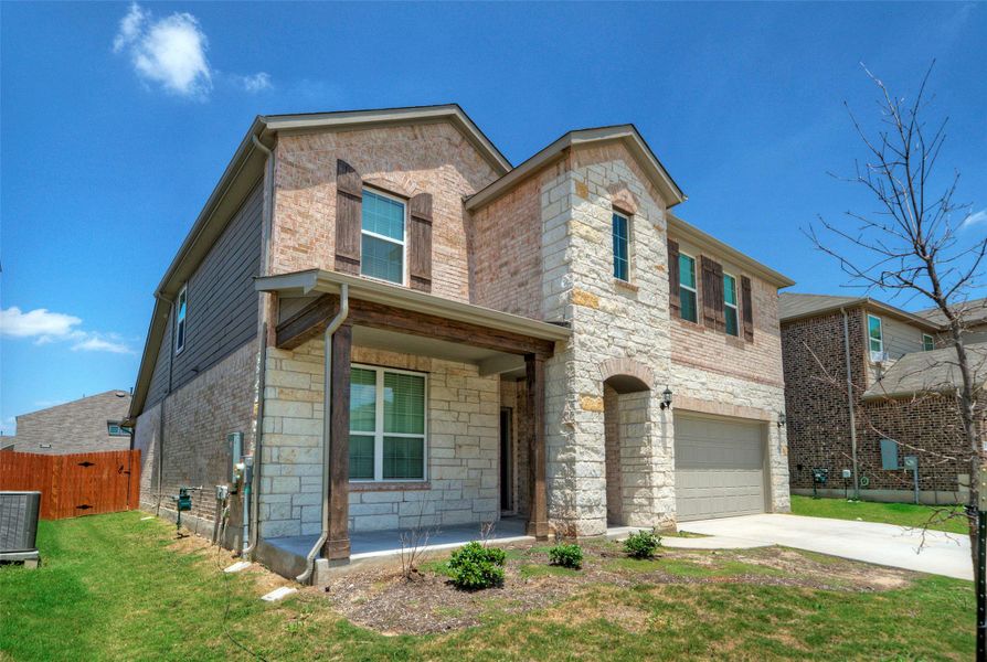 A charming stone and brick facade welcomes you to this inviting two-story residence. A charming stone and brick facade welcomes you to this inviting two-story residence.