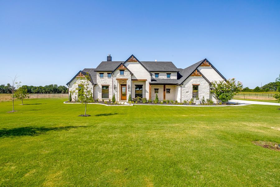 Front exterior of a new home in Santana Ridge - Brock ISD, Weatherford, TX, highlighting curb appeal (Image 1). Front exterior of a new home in Santana Ridge - Brock ISD, Weatherford, TX, highlighting curb appeal (Image 1).