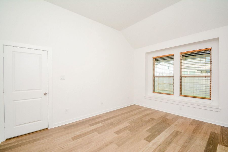 Spacious primary bedroom with large windows and abundant natural light. Spacious primary bedroom with large windows and abundant natural light.