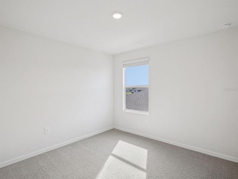 Spacious, unfurnished interior of a new home in The Grove at Stuart Crossing - Classic Series, Bartow (Image 36).