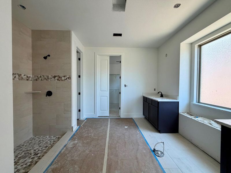 Primary Bath retreat with dual vanities, garden tub & walk-in shower