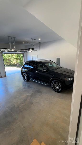 GLE 350 in garage to show how large the garage is. With car in garage you can still access the side door. Ton of space for second car. Tall ceilings for storage overhead