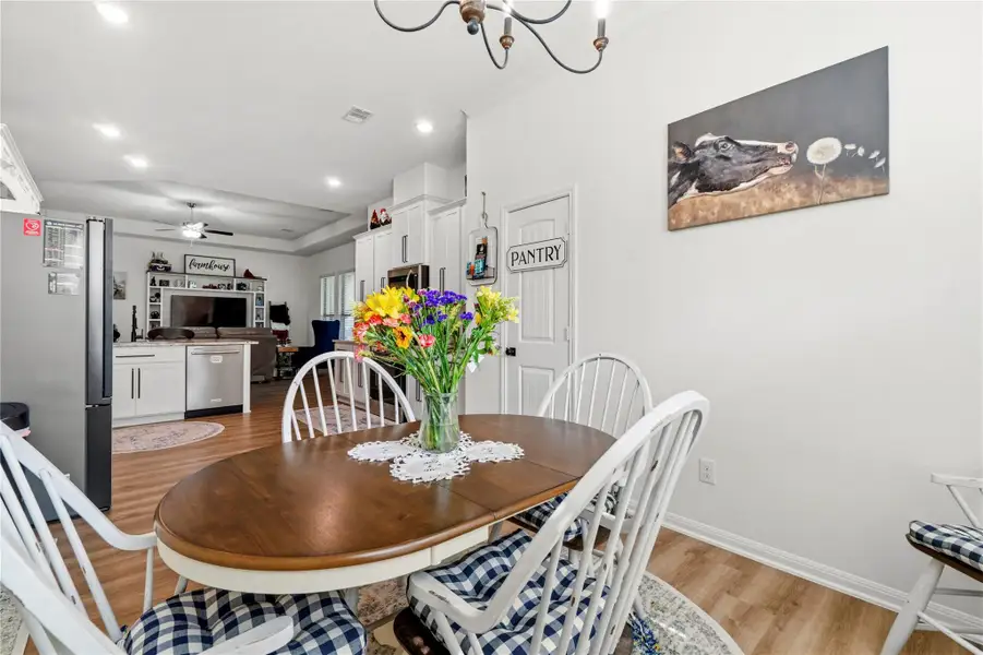The dining space feels warm and inviting, creating the perfect setting for slow mornings, family dinners, and gathering with friends.