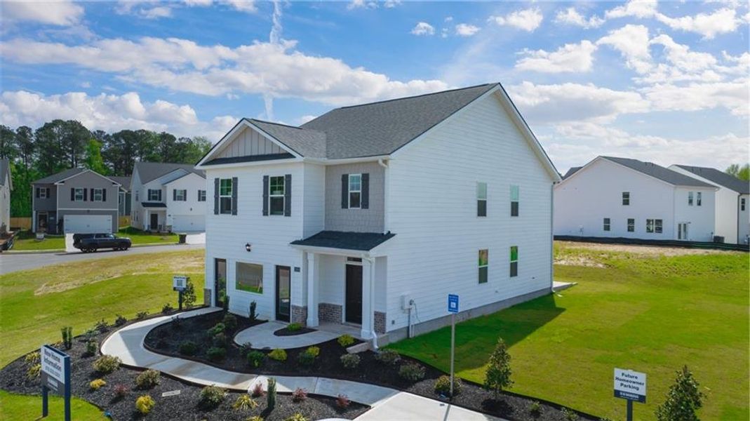 Front exterior of a new home in Shoal Creek, Hampton, GA, highlighting curb appeal (Image 1). Front exterior of a new home in Shoal Creek, Hampton, GA, highlighting curb appeal (Image 1).