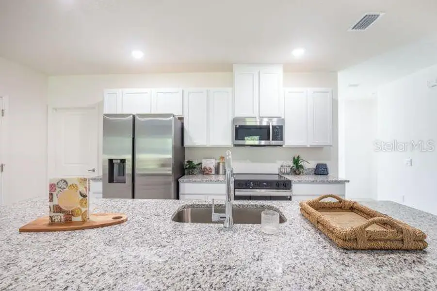 Furnished interior view inside a new home in Coastal Communities, Edgewater (Image 8).