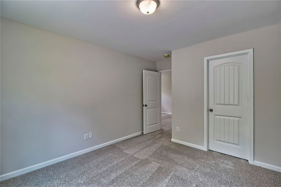 This cozy bedroom offers a tranquil retreat with s