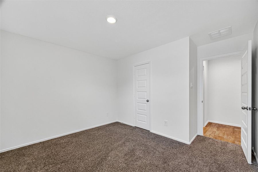 SECONDARY/2ND PRIMARY BEDROOM IN THE REAR OF THE HOME