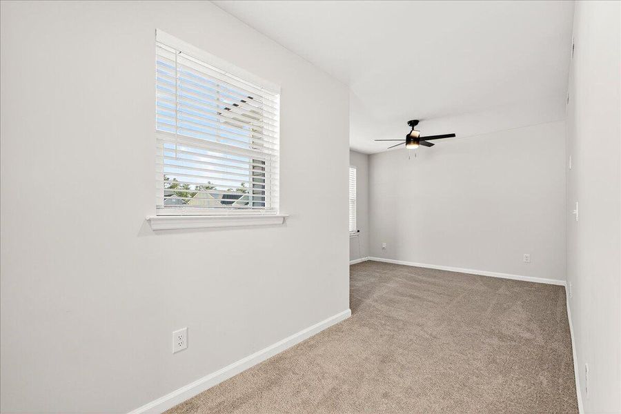 Spacious, unfurnished interior of a new home in Jasmine Point at Lakes of Cane Bay, Summerville (Image 23).