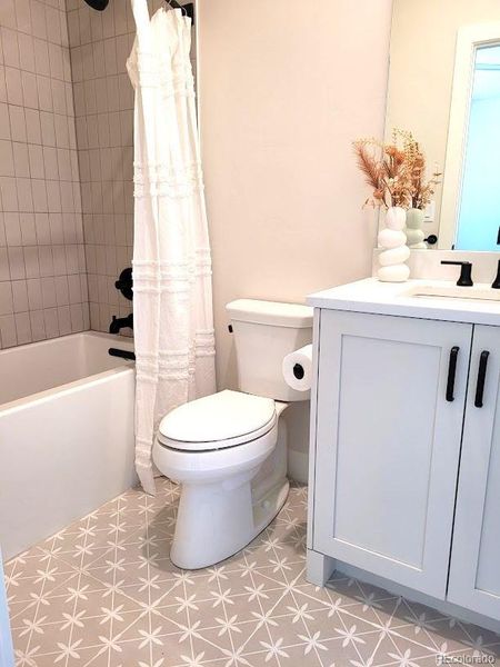 bathroom in ensuite bedroom, classic tile and cabinetry