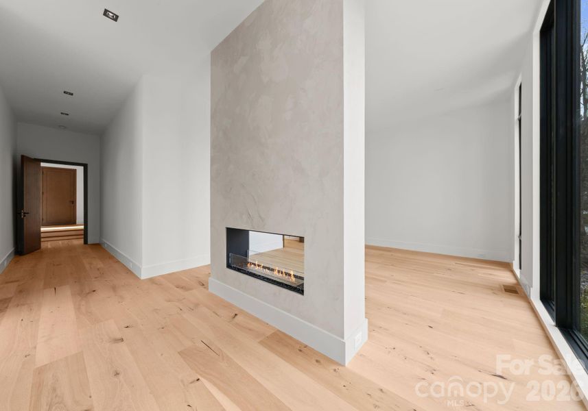 Primary suite located on the main level. Features a gas fireplace and stunning lake views. Primary suite located on the main level. Features a gas fireplace and stunning lake views.