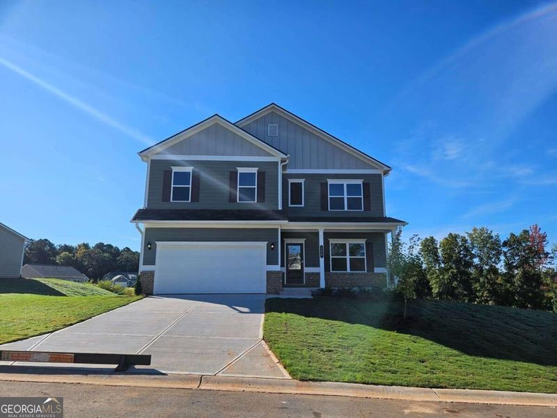 Front exterior of a new home in Maddox Station, Eatonton, GA, highlighting curb appeal (Image 20). Front exterior of a new home in Maddox Station, Eatonton, GA, highlighting curb appeal (Image 20).