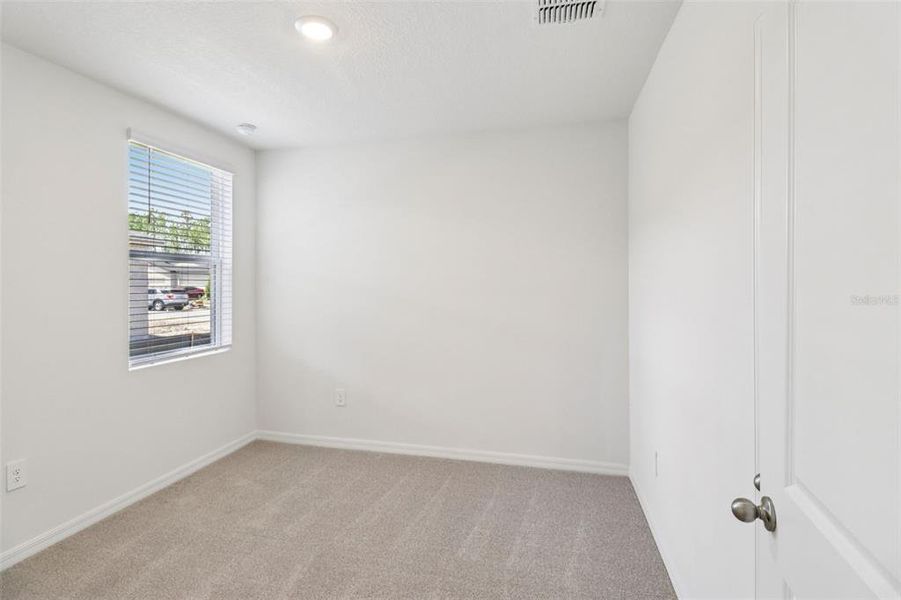 Spacious, unfurnished interior of a new home in Ridgehaven - Villas, Ormond Beach (Image 18).