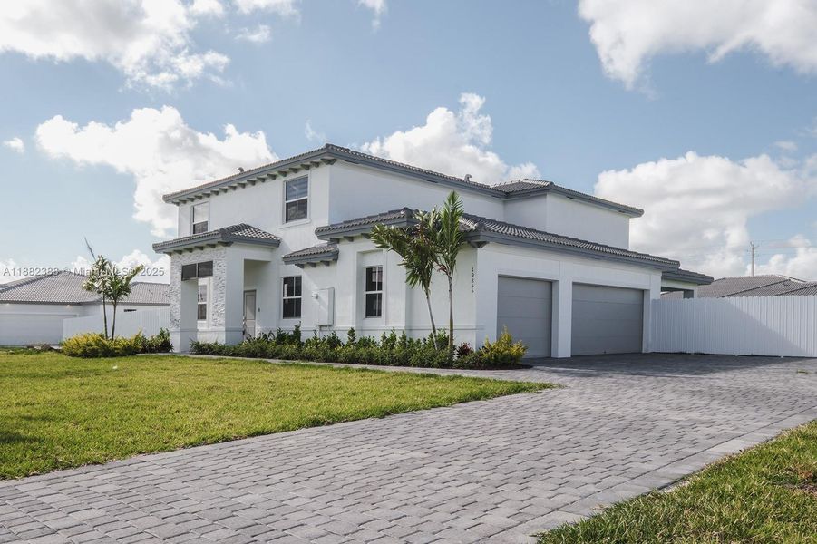 Front exterior of a new home in , Homestead, FL, highlighting curb appeal (Image 15).