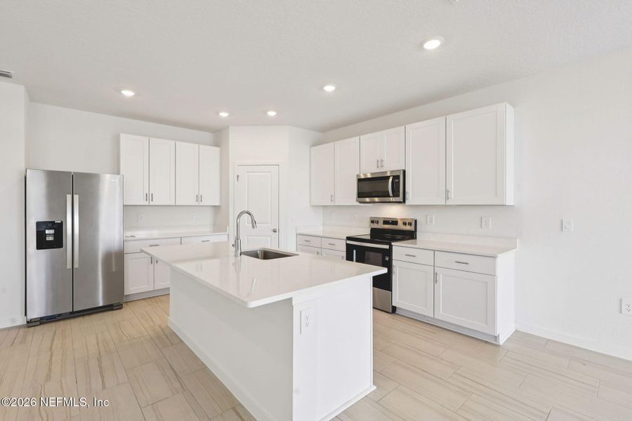 Furnished interior view inside a new home in Lakes at Bella Lago - Signature Series, Green Cove Springs (Image 9).