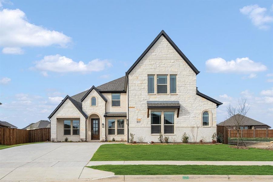 Front exterior of a new home in Wildflower Ranch 60-65, Fort Worth, TX, highlighting curb appeal (Image 2).