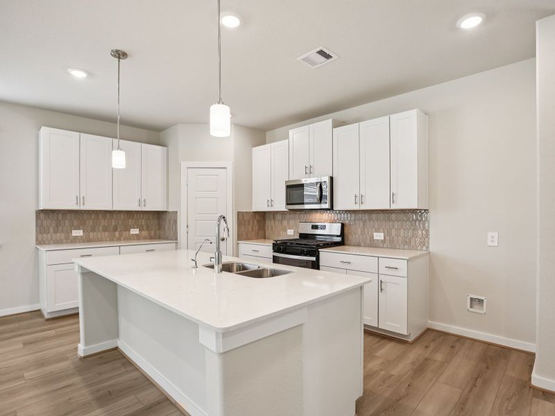 Furnished interior view inside a new home in Sundance Cove - Premier Series, Crosby (Image 4).