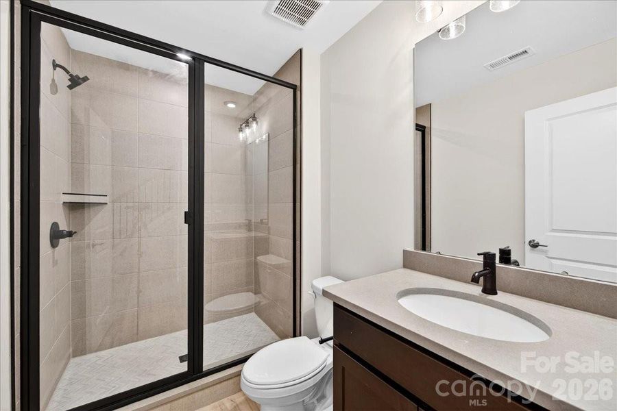 First floor full bathroom with tiled walk-in shower