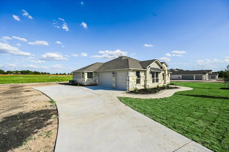Representative exterior photo of a completed home built from the Llano II by Giddens Homes in Whispering Wind, Bertram, TX (Image 33). Representative exterior photo of a completed home built from the Llano II by Giddens Homes in Whispering Wind, Bertram, TX (Image 33).