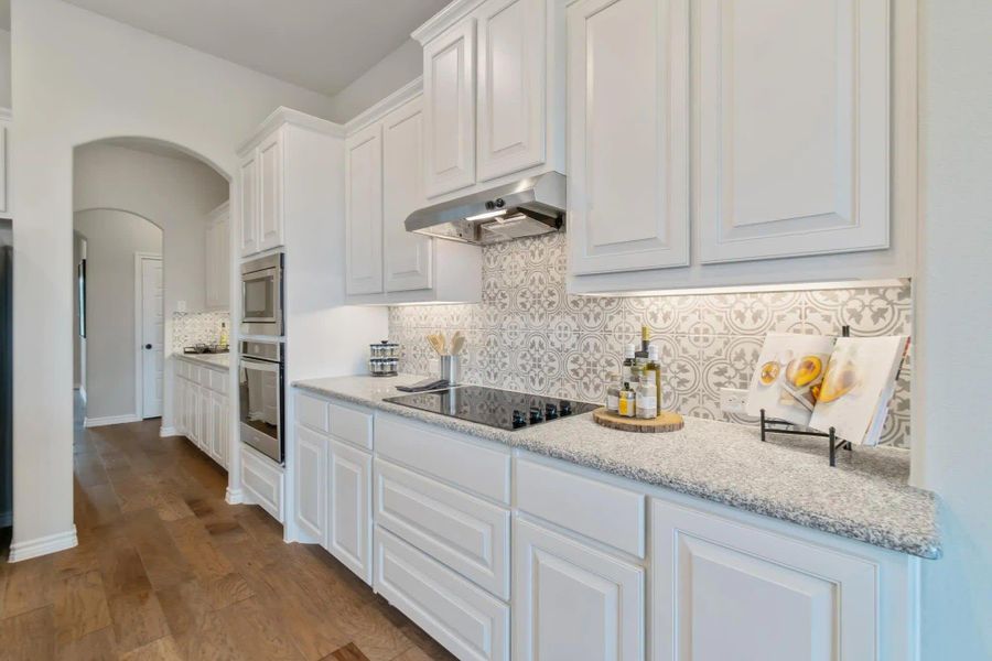 Kitchen | Concept 2434 at Coyote Crossing in Godley, TX by Landsea Homes