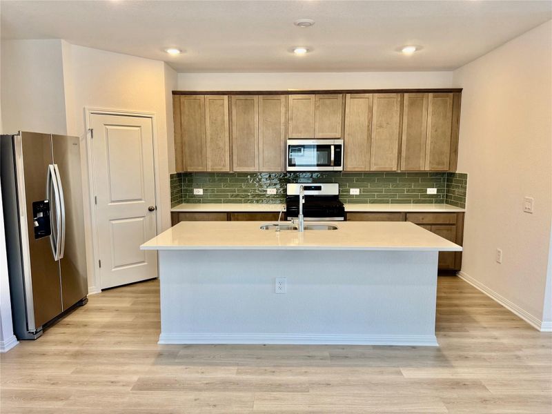 Furnished interior view inside a new home in Lexington Parke, Del Valle (Image 4).