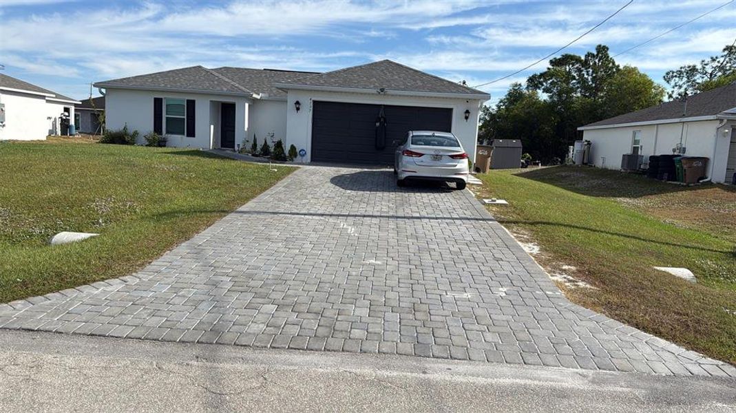 Front exterior of a new home in , Cape Coral, FL, highlighting curb appeal (Image 2). Front exterior of a new home in , Cape Coral, FL, highlighting curb appeal (Image 2).