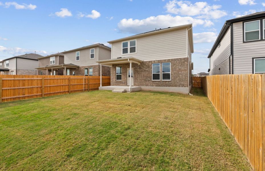 Exterior details and patio area of a home in Crosswinds, Kyle (Image 3).