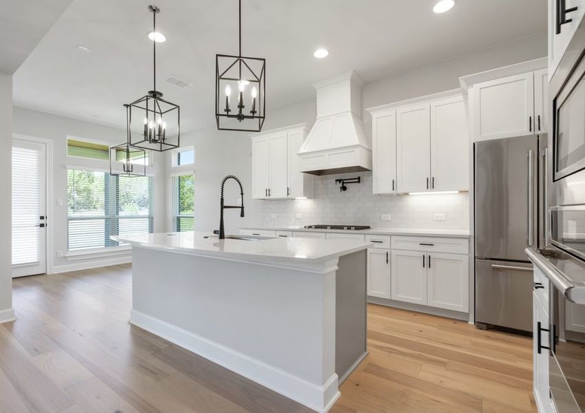 The kitchen has beautiful white cabinets. The kitchen has beautiful white cabinets.