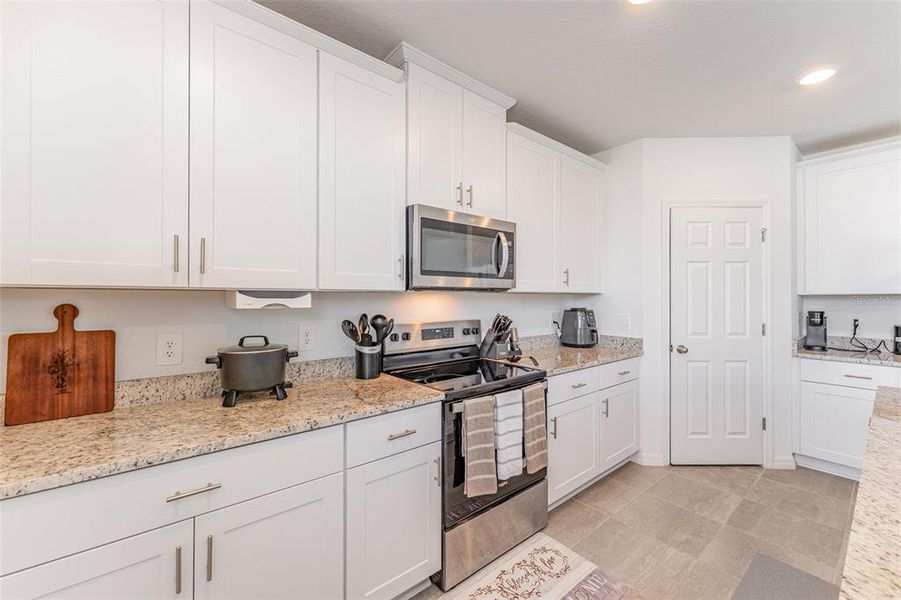 Furnished interior view inside a new home in Villamar - Signature Series, Winter Haven (Image 5).