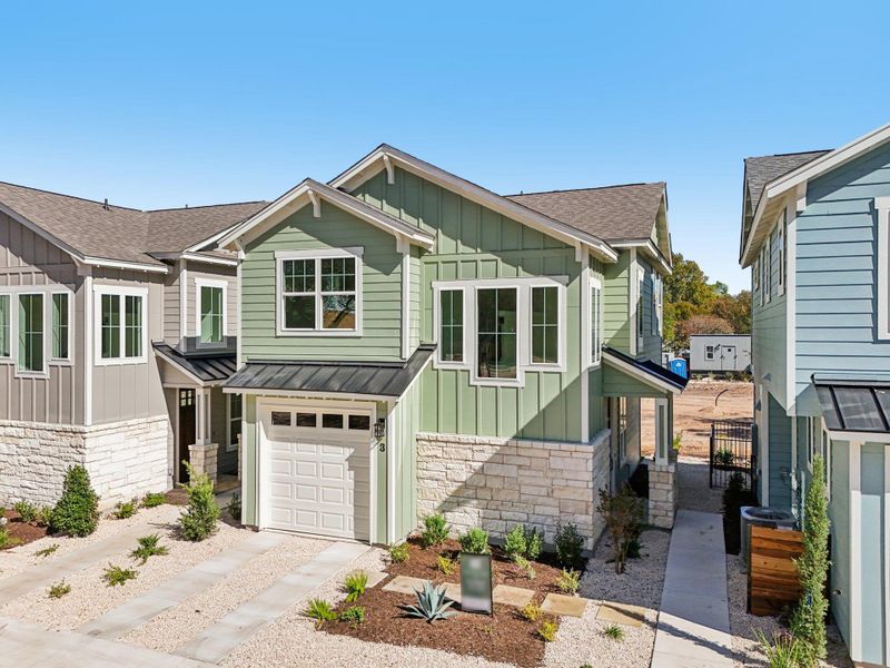 View of front of home with stone siding, board and batten siding View of front of home with stone siding, board and batten siding
