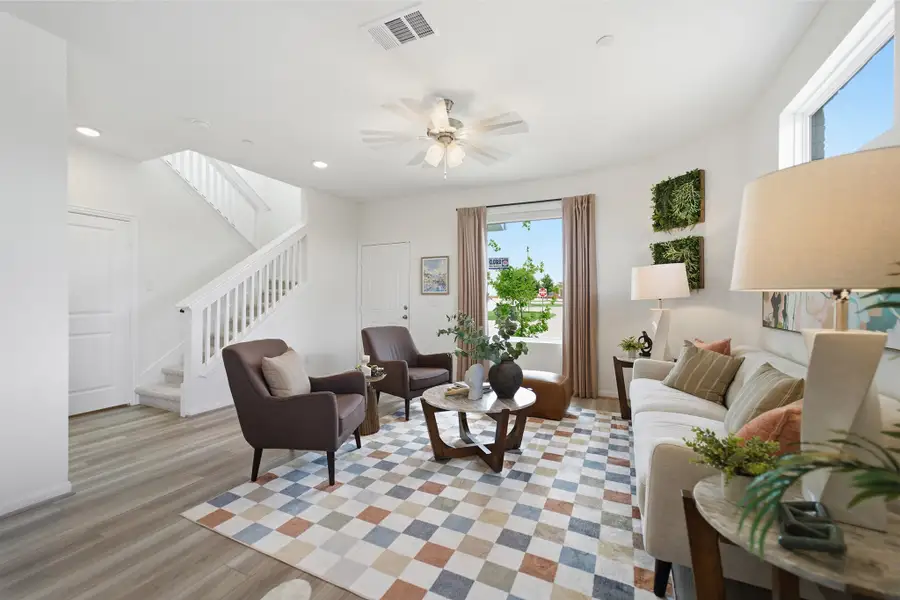 Representative furnished interior of a home built from the Kahn by CastleRock Communities in Municipal Drive Townhomes, Leander (Image 9).