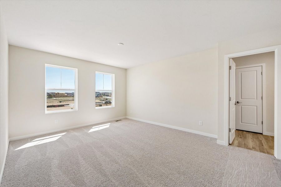 A room with a window and a door.
