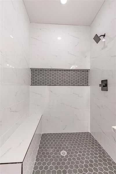 Bathroom featuring tiled shower