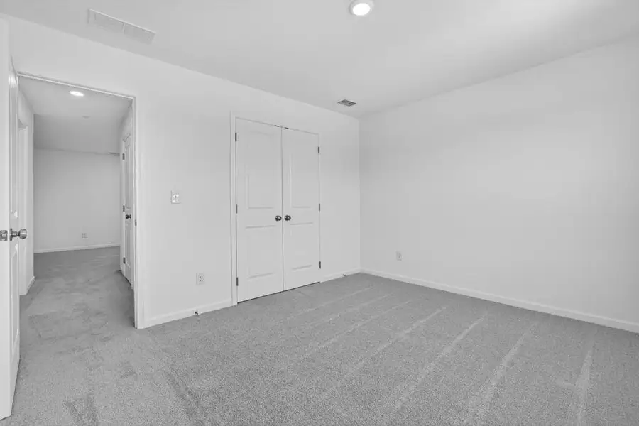 Spacious, unfurnished interior of a new home in Weatherfield, Buford (Image 20).