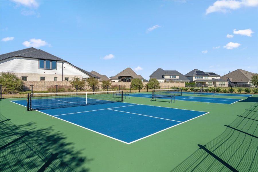 Dedicated Pickleball and Tennis Courts for neighborhood sports and recreation.