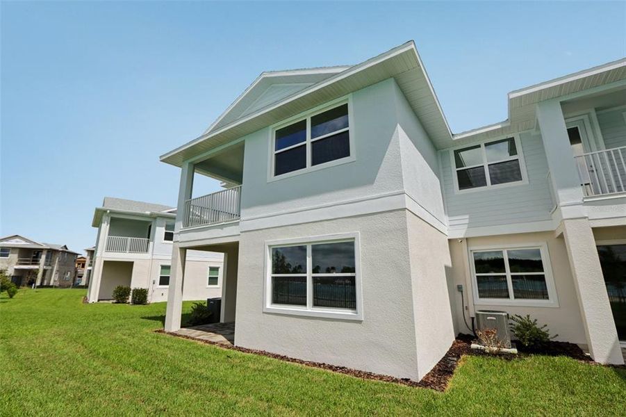 Exterior details and patio area of a home in Lagoon Residences at Epperson, Wesley Chapel (Image 30).