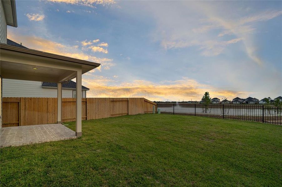 The view from the backyard is stunning. There is a community lake and gorgeous sunsets.