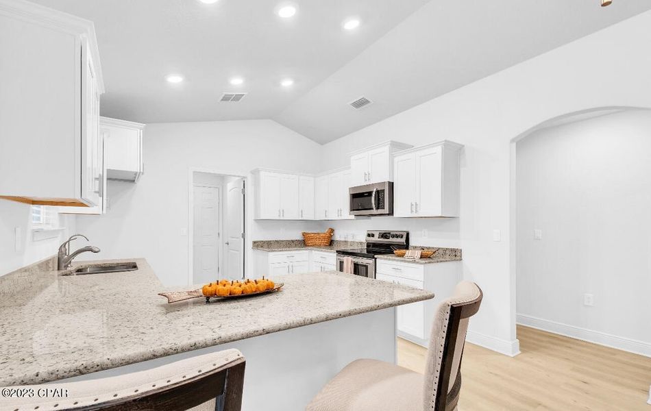 Representative furnished interior of a home built from the Plan 1520 by Adams Homes in East Bay, Panama City (Image 6).