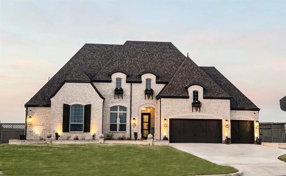Front exterior of a new home in Pecan Square: 100ft. lots, Northlake, TX, highlighting curb appeal (Image 1). Front exterior of a new home in Pecan Square: 100ft. lots, Northlake, TX, highlighting curb appeal (Image 1).