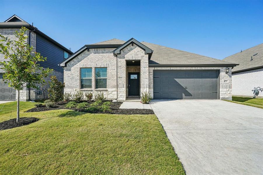 Front exterior of a new home in Lakehaven - Signature Series, Farmersville, TX, highlighting curb appeal (Image 1). Front exterior of a new home in Lakehaven - Signature Series, Farmersville, TX, highlighting curb appeal (Image 1).