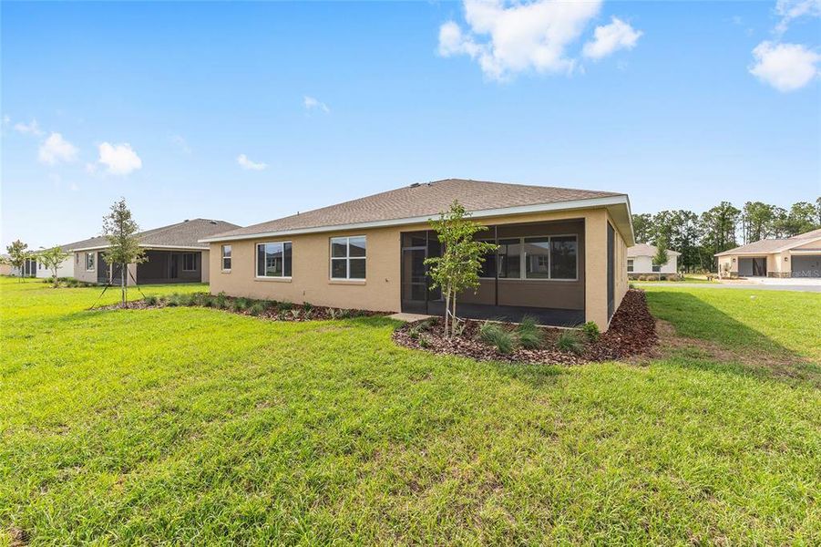 Exterior details and patio area of a home in On Top of the World Communities, Ocala (Image 2).