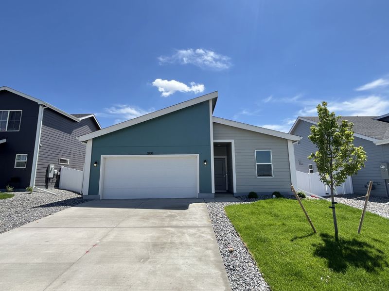 Front exterior of a new home in Liberty Draw, Evans, CO, highlighting curb appeal (Image 2). Front exterior of a new home in Liberty Draw, Evans, CO, highlighting curb appeal (Image 2).
