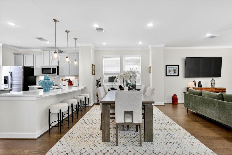 Open-concept design combining the dining area and gourmet kitchen—ideal for entertaining with abundant natural light and seamless flow. Open-concept design combining the dining area and gourmet kitchen—ideal for entertaining with abundant natural light and seamless flow.