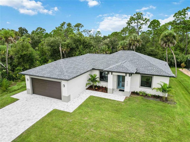 Front exterior of a new home in , North Port, FL, highlighting curb appeal (Image 18).