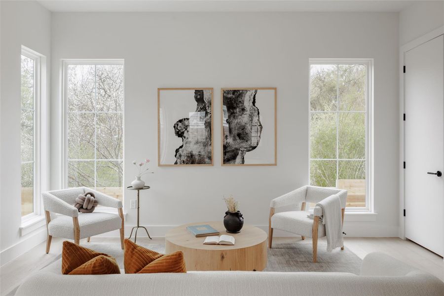 Sitting room with light wood-style floors