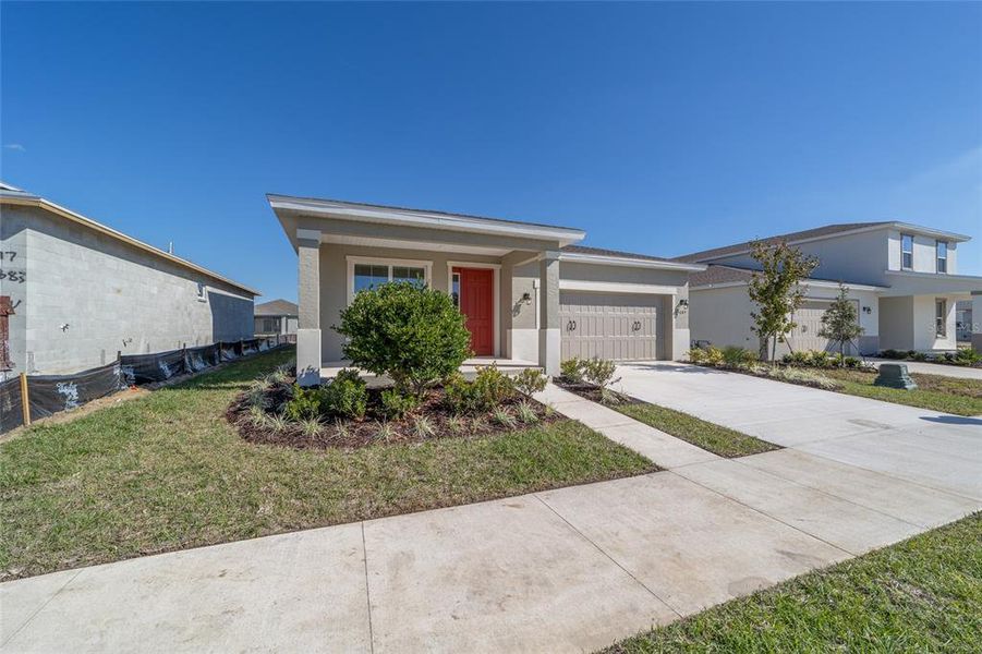 Front exterior of a new home in Calesa Township, Ocala, FL, highlighting curb appeal (Image 19).