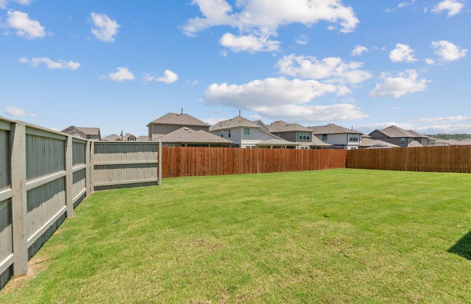 Front exterior of a new home in Saddleback at Santa Rita Ranch, Liberty Hill, TX, highlighting curb appeal (Image 2).