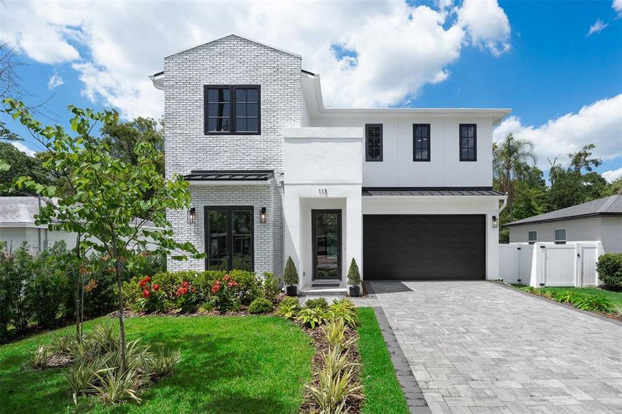 Front exterior of a new home in College Park, Orlando, FL, highlighting curb appeal (Image 25).